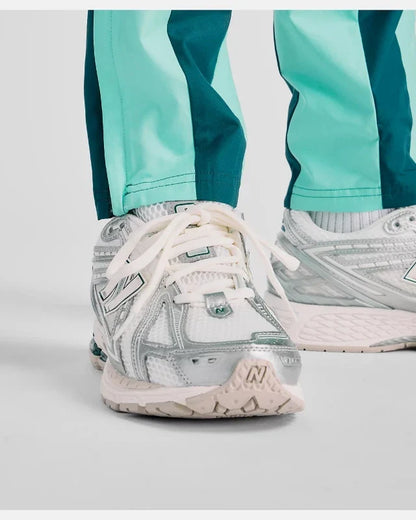 Pantalon New Balance Utility Woven - Vert